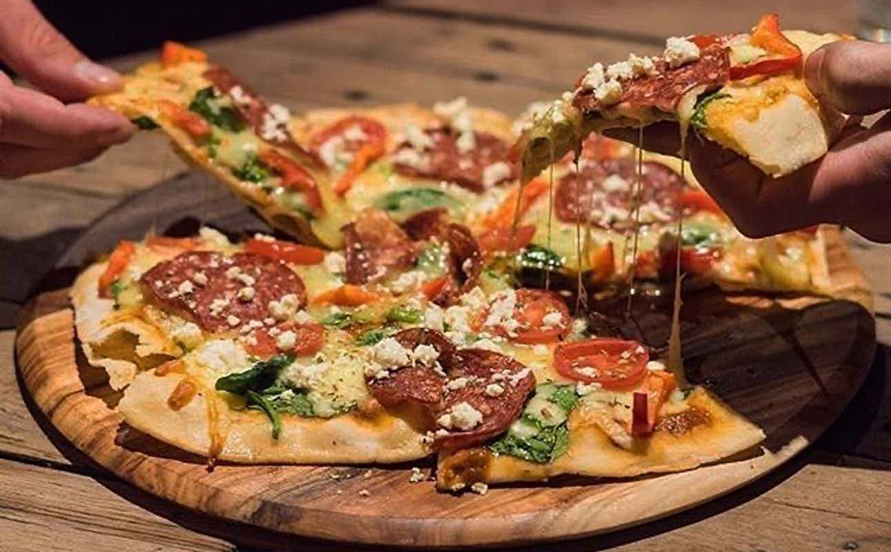 Enjoy Pizza, Burgers, Vegan Options, Vegetarian options, Gluten Free Options, Bars & Pubs, Table service, $$, Groups and Live music cuisine at Jack & Bones Island Bar in East End, Melbourne