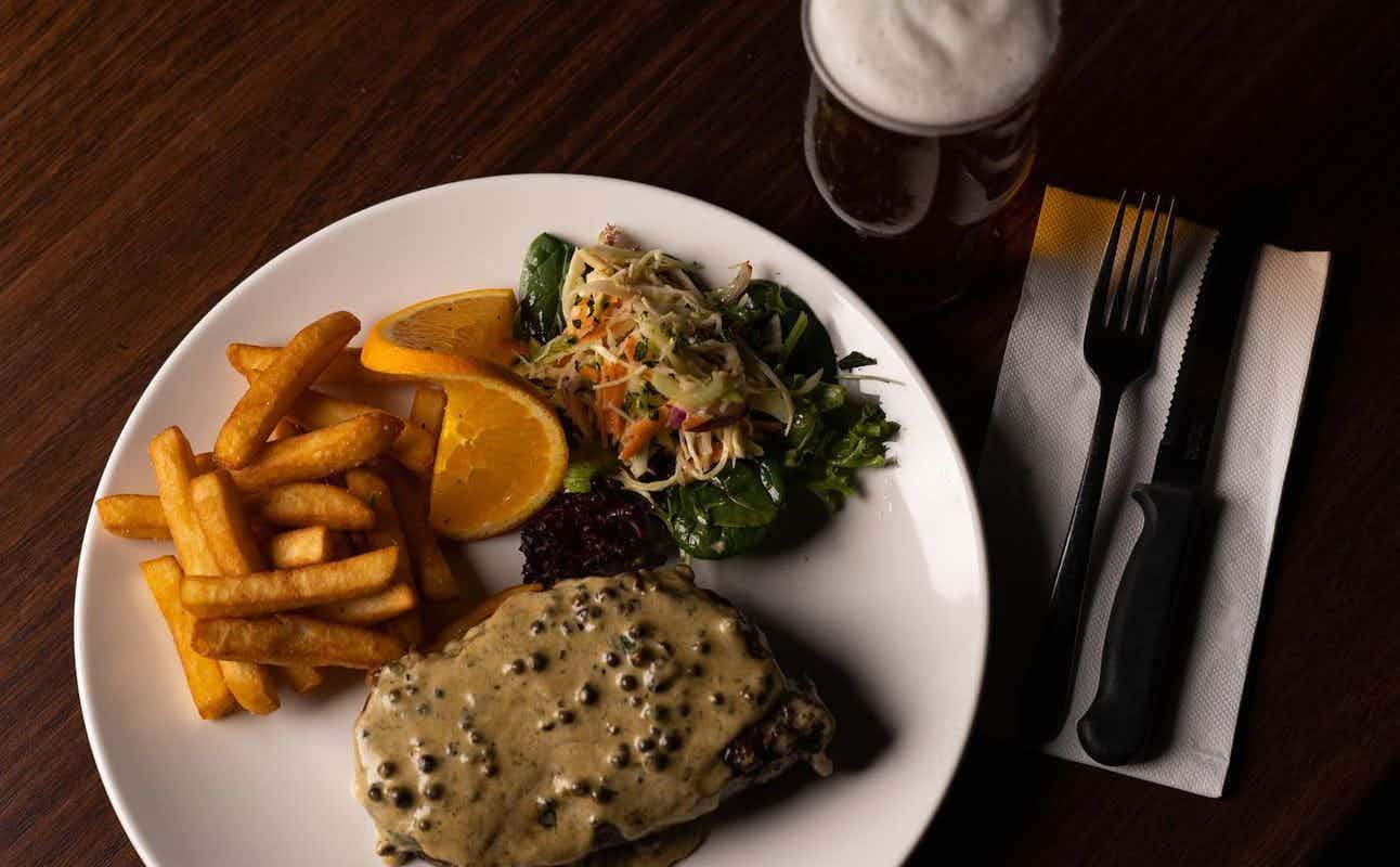 Enjoy Pub Food, Vegetarian options, Vegan Options, Gluten Free Options, Bars & Pubs, Indoor & Outdoor Seating, Highchairs available, Free Wifi, Dog friendly, $$ and Live music cuisine at The Leadbeater Hotel in Richmond, Melbourne
