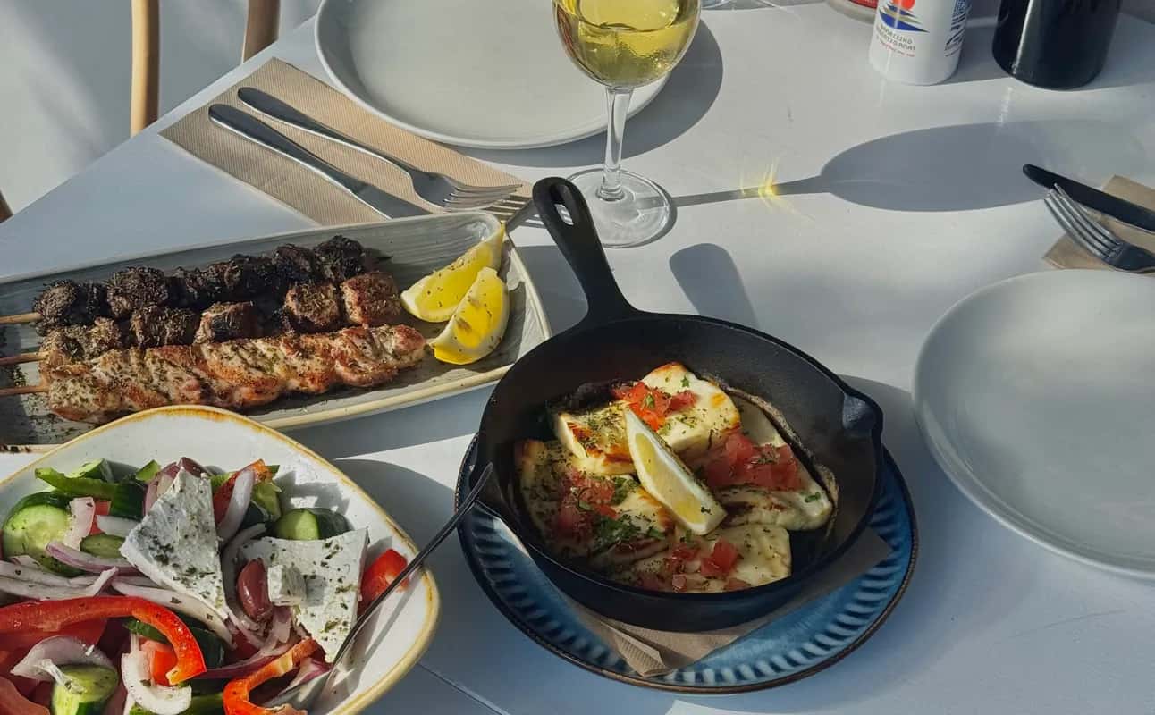 Enjoy Greek, Vegetarian options, Restaurant, Dog friendly, Highchairs available, Indoor & outdoor seating, Street parking, Table service, $$, Groups, Families and Live music cuisine at GRK Meze Grill in Ramsgate, Sydney