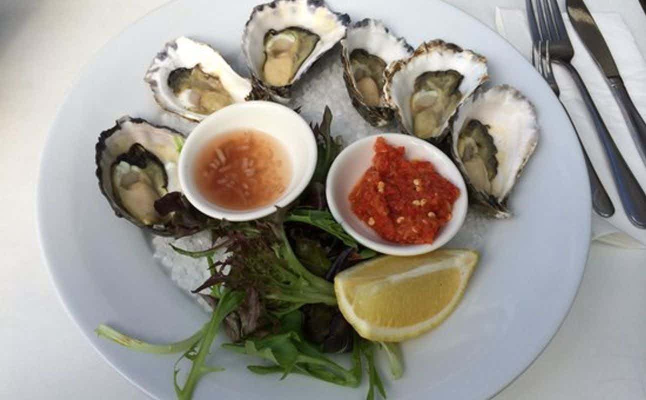 Enjoy Australian, Burgers and Seafood cuisine at Bluewater Cafe in Manly, Sydney