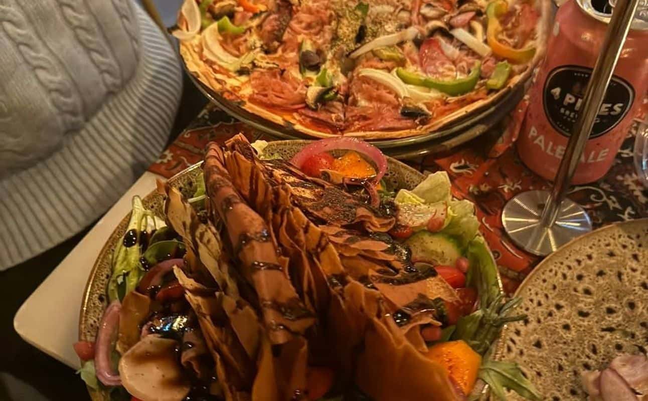 Enjoy Italian, Syrian, Restaurant, Table service, Indoor & outdoor seating, $$, Families, Local cuisine, Kids and Groups cuisine at Killarney Pizza Tapas Wine Bar in Killarney Heights, Sydney