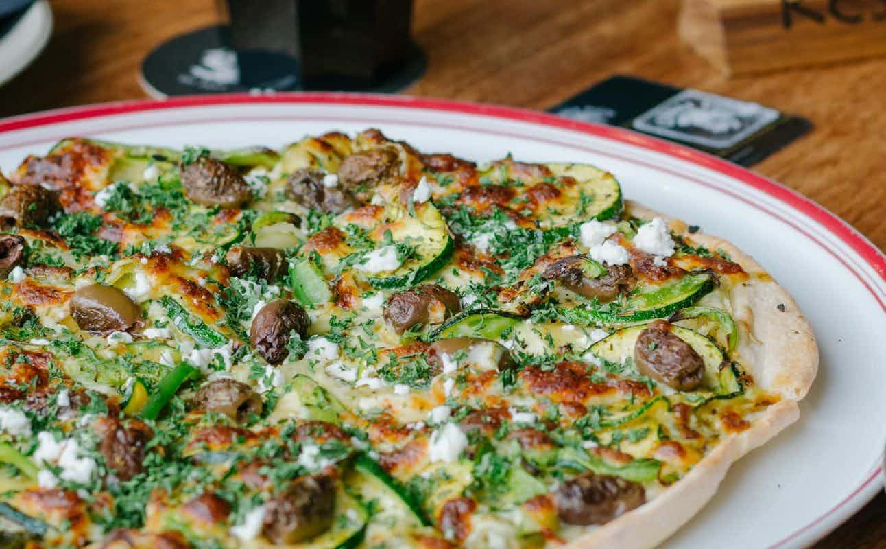 Enjoy Pizza, Italian, Australian, Vegan Options, Vegetarian options, Restaurant, Highchairs available, Wheelchair accessible, Table service, Indoor & Outdoor Seating, $$, Families, Groups and Views cuisine at Lennox Pizza in Lennox Head, Byron Bay & surrounds